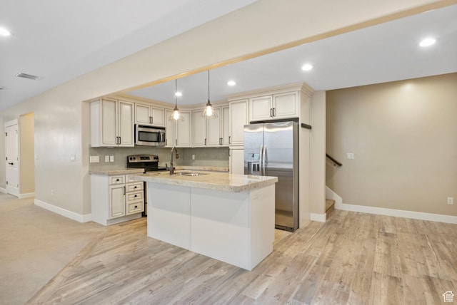 kitchen with stainless steel appliances, baseboards, decorative backsplash, a sink, and pendant lighting