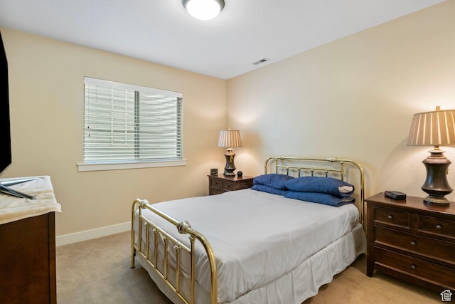 carpeted bedroom featuring baseboards