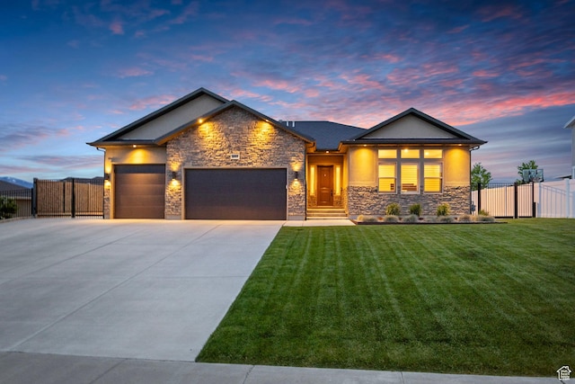 view of front of property with stone siding, an attached garage, concrete driveway, and stucco siding