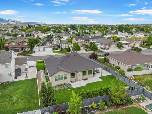 aerial view of residential area featuring a mountainous background