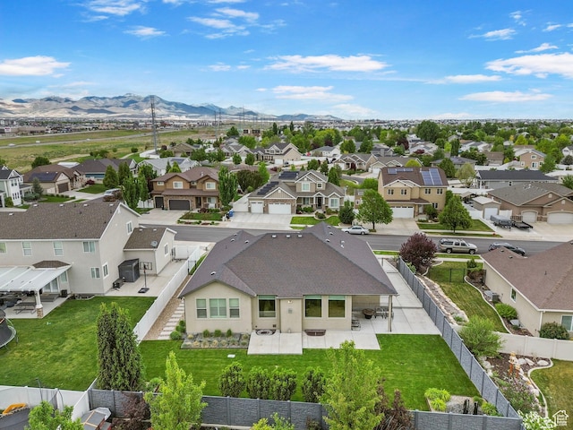 aerial view of residential area featuring mountains