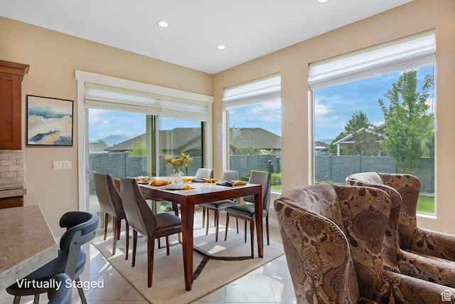 dining space featuring recessed lighting and light tile patterned floors