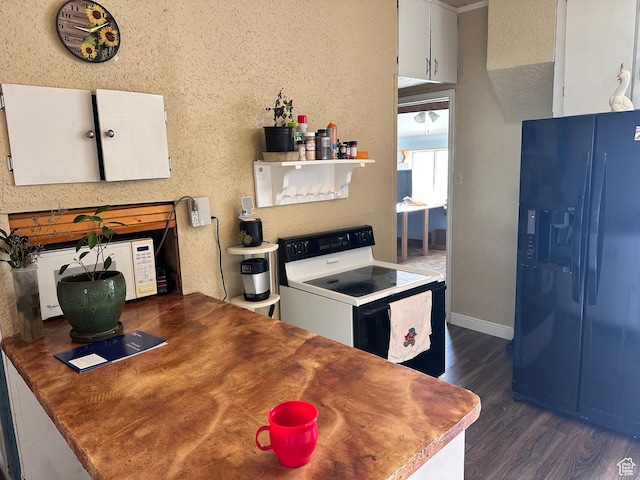 kitchen with black fridge with ice dispenser, electric stove, dark wood finished floors, white cabinetry, and baseboards
