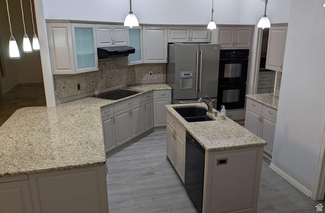 3526 S 1470 W, St George, UT 84790 - kitchen featuring black appliances, a sink, under cabinet range hood, tasteful backsplash, and light wood-style floors