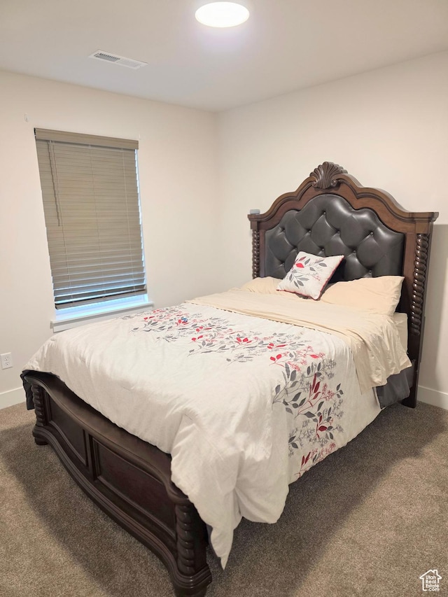 bedroom with carpet and baseboards