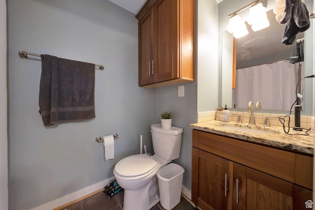 125 E 1st Ave Unit 206, Salt Lake City, UT 84103 - bathroom with toilet, vanity, baseboards, tile patterned flooring, and a shower with shower curtain