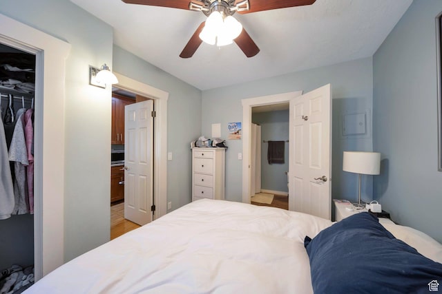 125 E 1st Ave Unit 206, Salt Lake City, UT 84103 - bedroom with a closet, a walk in closet, a ceiling fan, and light wood-style flooring