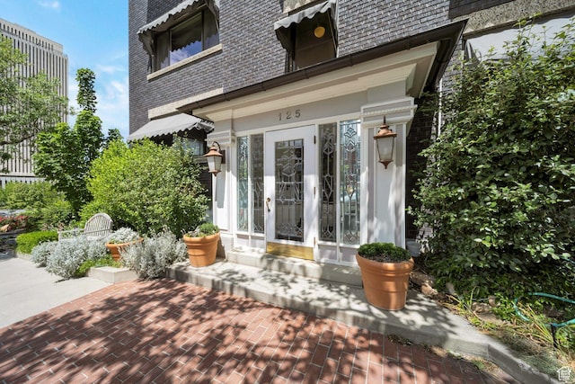 125 E 1st Ave Unit 206, Salt Lake City, UT 84103 - doorway to property featuring brick siding