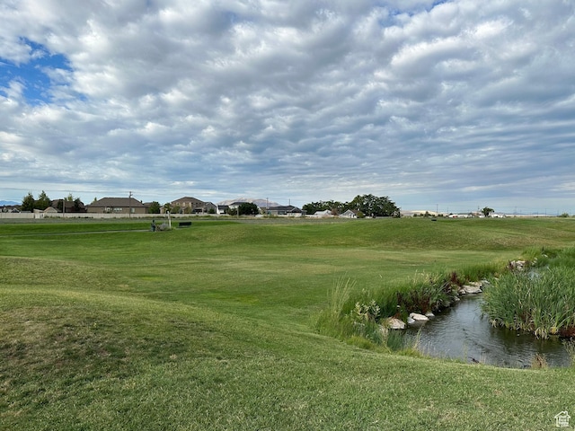 view of property's community featuring a yard