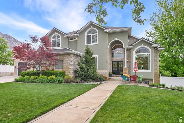 857 E 3250 N, North Ogden, UT 84414 - traditional-style home with french doors, brick siding, and stucco siding