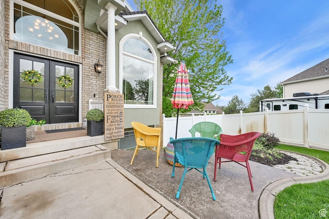 857 E 3250 N, North Ogden, UT 84414 - view of patio with fence, french doors, and outdoor dining area