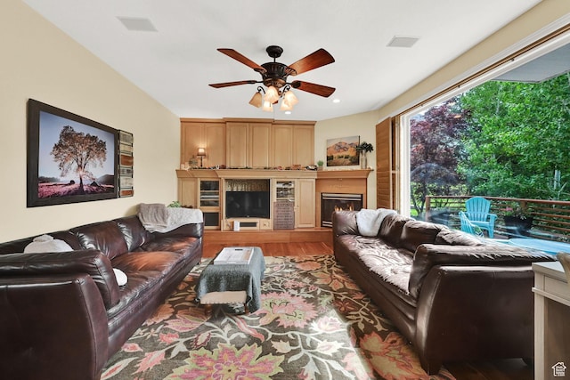 857 E 3250 N, North Ogden, UT 84414 - living area featuring a ceiling fan, wood finished floors, and a lit fireplace
