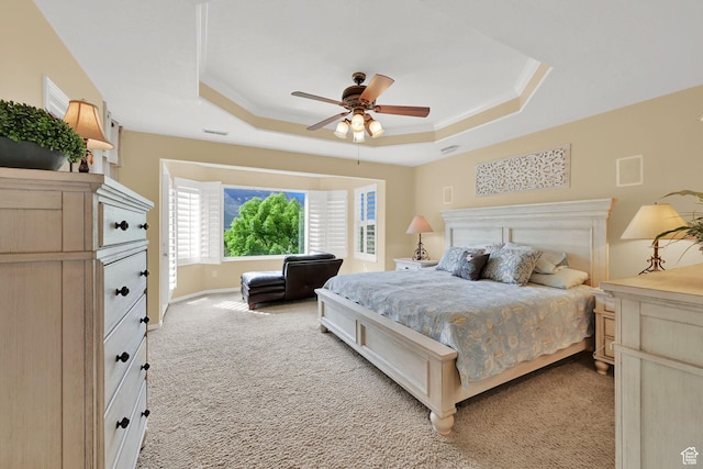 857 E 3250 N, North Ogden, UT 84414 - bedroom featuring a raised ceiling, light colored carpet, a ceiling fan, and baseboards