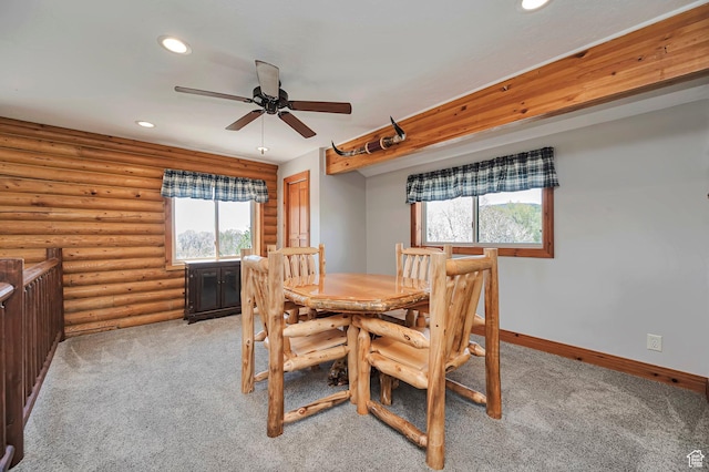 dining room with ceiling fan, recessed lighting, light carpet, rustic walls, and baseboards