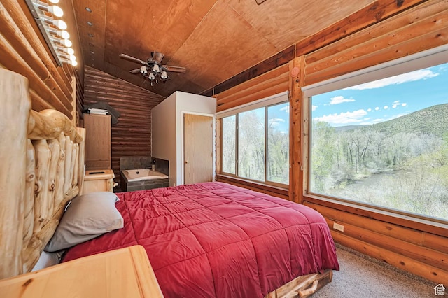 bedroom featuring rustic walls, vaulted ceiling, wood ceiling, and carpet flooring