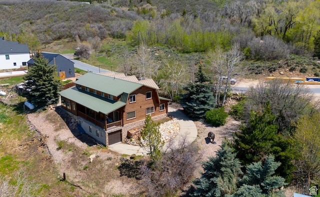 view of subject property featuring a forest