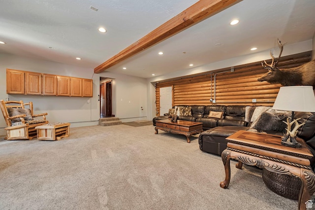 living room featuring carpet flooring, recessed lighting, beam ceiling, baseboards, and rustic walls