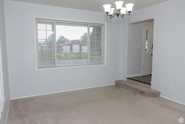 135 N 3rd E, Preston, ID 83263 - unfurnished room with a chandelier, carpet floors, and baseboards