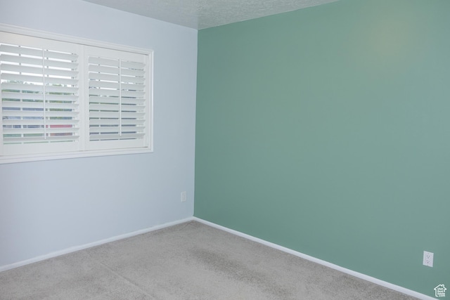 135 N 3rd E, Preston, ID 83263 - spare room featuring carpet floors, baseboards, and a textured ceiling