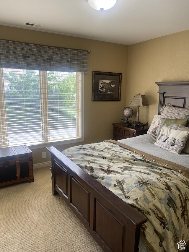 bedroom with light carpet