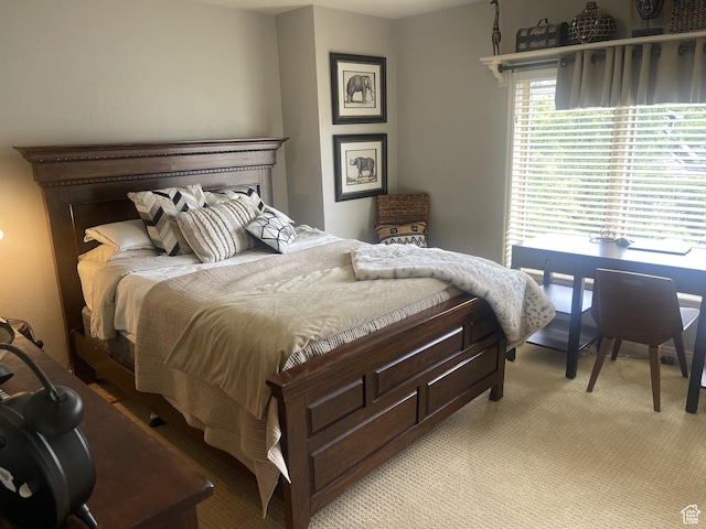 bedroom featuring light carpet