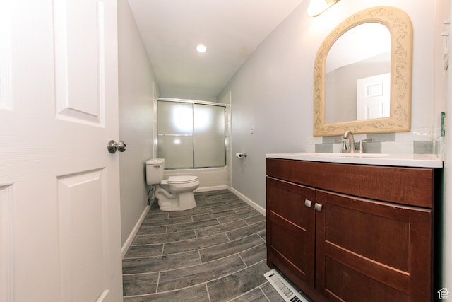 4872 S Burch Creek Dr, South Ogden, UT 84403 - full bath with bath / shower combo with glass door, vanity, toilet, baseboards, and wood tiled floors