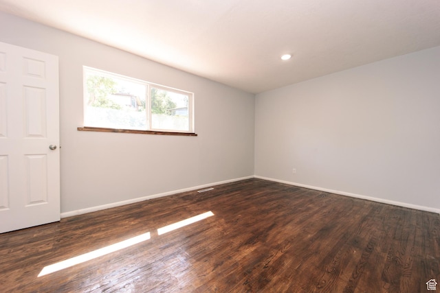 4872 S Burch Creek Dr, South Ogden, UT 84403 - empty room featuring dark wood finished floors, baseboards, and recessed lighting
