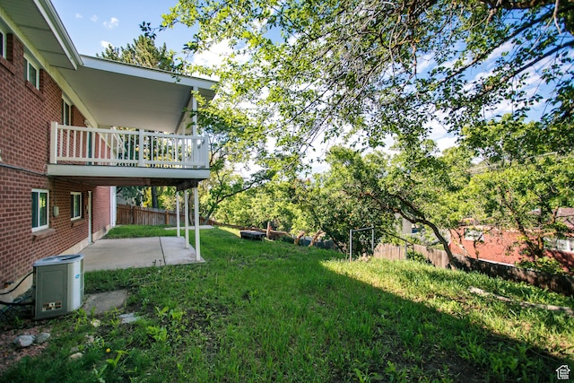 4872 S Burch Creek Dr, South Ogden, UT 84403 - view of yard with a patio area, a balcony, and central AC unit