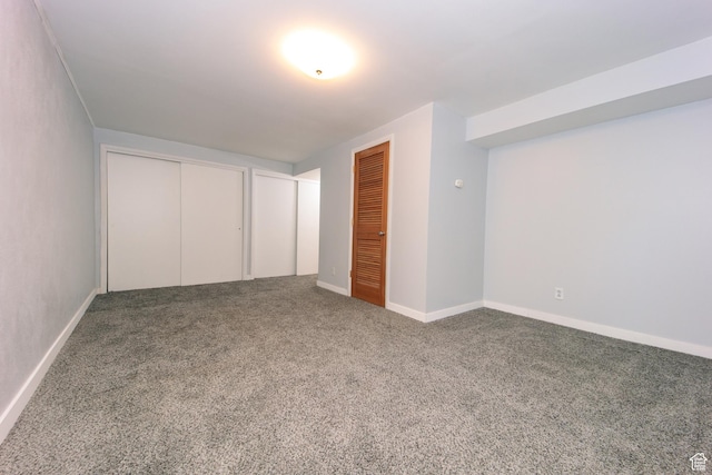 4872 S Burch Creek Dr, South Ogden, UT 84403 - unfurnished bedroom featuring carpet flooring, two closets, and baseboards