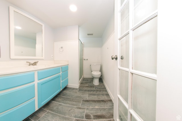 4872 S Burch Creek Dr, South Ogden, UT 84403 - full bath featuring vanity, a shower stall, toilet, and wood finished floors