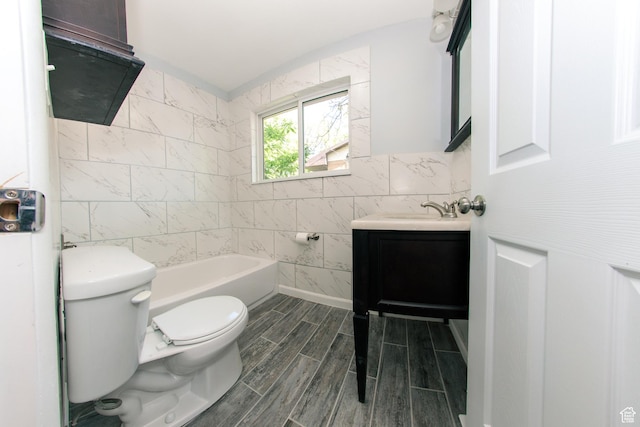 4872 S Burch Creek Dr, South Ogden, UT 84403 - bathroom featuring tile walls, toilet, vanity, a bathtub, and wood tiled floors