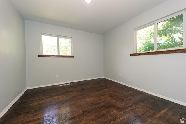 4872 S Burch Creek Dr, South Ogden, UT 84403 - unfurnished room featuring baseboards and dark wood-style floors
