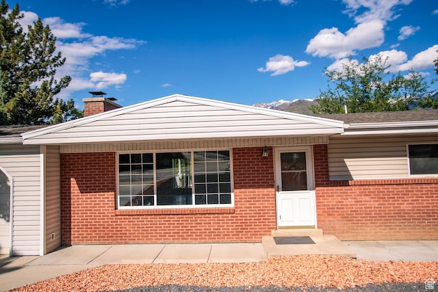 4872 S Burch Creek Dr, South Ogden, UT 84403 - view of front of home featuring a chimney and brick siding