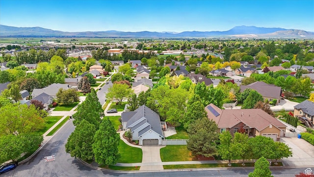 aerial perspective of suburban area featuring a mountainous background