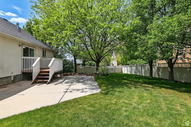 view of yard featuring a patio and a deck