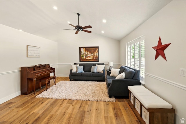 living area featuring ceiling fan, recessed lighting, vaulted ceiling, light wood-type flooring, and baseboards