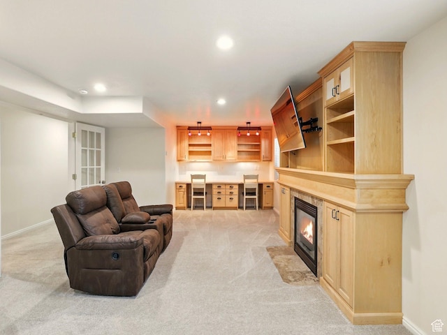 living room featuring light carpet, recessed lighting, baseboards, and a fireplace