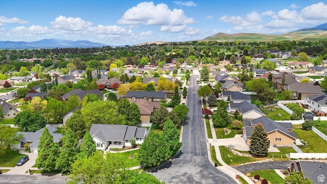 aerial view of residential area featuring mountains