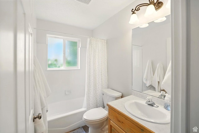 full bathroom featuring toilet, vanity, and shower / bath combo with shower curtain