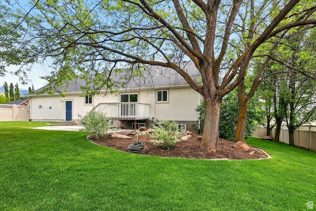 rear view of house with stucco siding