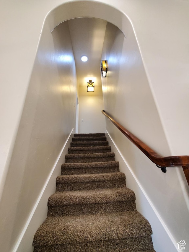 stairs featuring recessed lighting