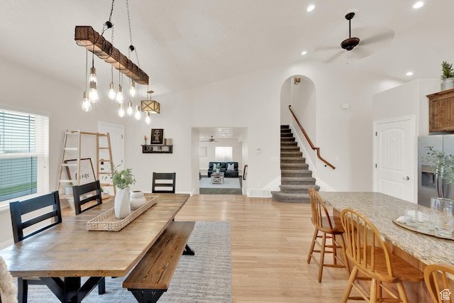 616 W Northlake Dr, Lehi, UT 84043 - dining area with a ceiling fan, stairway, light wood-type flooring, high vaulted ceiling, and recessed lighting