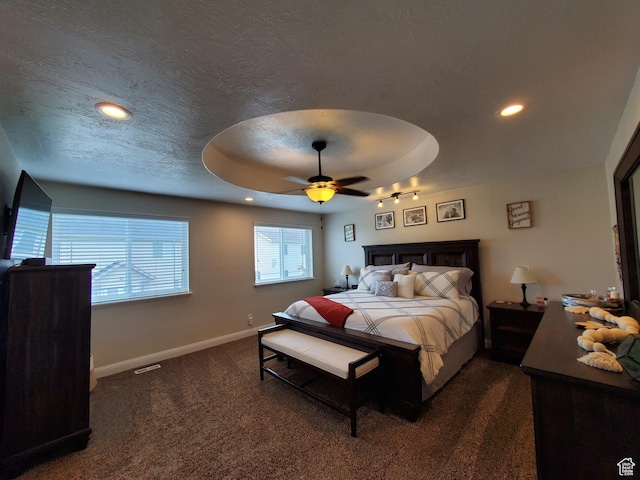 bedroom with dark carpet, baseboards, recessed lighting, ceiling fan, and a textured ceiling