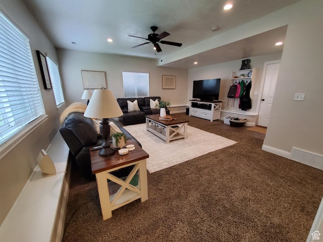 living room with a ceiling fan, dark colored carpet, recessed lighting, and baseboards