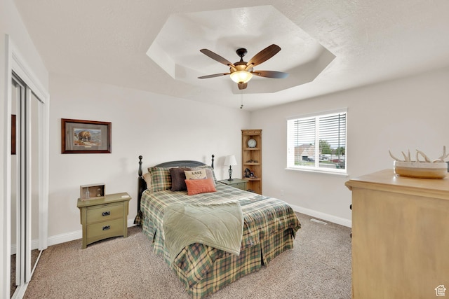 616 W Northlake Dr, Lehi, UT 84043 - bedroom featuring carpet flooring, baseboards, a tray ceiling, and ceiling fan