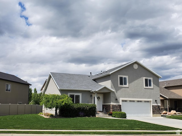 view of front of home with stucco siding, a garage, driveway, and stone siding