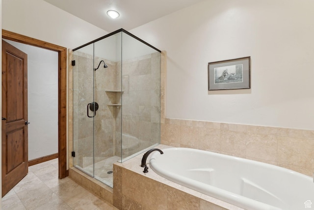 full bath featuring a shower stall and a bath