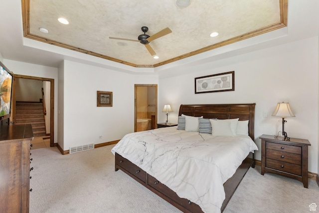 bedroom with a raised ceiling, carpet, ornamental molding, recessed lighting, and baseboards