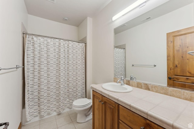 bathroom featuring toilet, tile patterned floors, vanity, and a shower with shower curtain