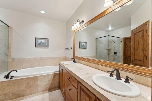 full bath featuring a shower stall, a garden tub, tile patterned floors, and double vanity